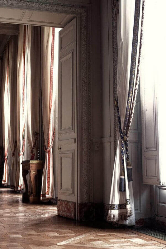 How to make your home look luxurious on a budget – cover an entire wall with curtains!