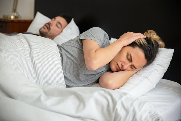 How to Get a Good Night's Sleep with a Snoring Partner