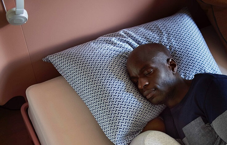 guy-sleeping-on-memory-foam-pillow