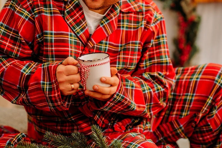 guy wearing ryd pyjamas drinking coffee