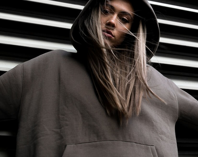 woman wearing oversized brown hoodie